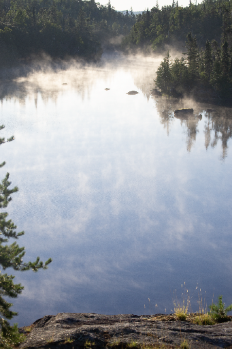 reflection2 tranquil lake on a misty morning